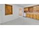 Simple kitchen with vintage wood cabinets, neutral countertops, and natural lighting at 505 Maple St, Golden, CO 80403
