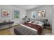 Stylishly staged main bedroom with modern decor, carpet flooring, and ample natural light at 505 Maple St, Golden, CO 80403