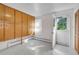 Bright mudroom features a bank of cabinets, tile flooring, and an exterior door to let the outside in at 505 Maple St, Golden, CO 80403