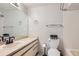 Bathroom featuring a large mirror, neutral countertop, and a toilet at 20 S Boulder Cir # 2303, Boulder, CO 80303
