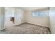 Bedroom with neutral carpet, a window, and doorway to the hall at 20 S Boulder Cir # 2303, Boulder, CO 80303