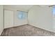 Bedroom with neutral carpet, light colored walls, window and closet at 20 S Boulder Cir # 2303, Boulder, CO 80303
