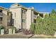 Multi-level condo with balconies and stucco exterior, surrounded by mature landscaping at 20 S Boulder Cir # 2303, Boulder, CO 80303