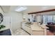 Bright kitchen featuring stainless steel sink, white appliances, and a view of the living room at 20 S Boulder Cir # 2303, Boulder, CO 80303
