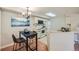 Bright kitchen with a dining table and blue mountain wall art at 20 S Boulder Cir # 2303, Boulder, CO 80303