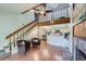Inviting living room featuring a fireplace, staircase, and a view of the kitchen and dining area at 20 S Boulder Cir # 2303, Boulder, CO 80303
