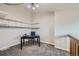 Office with mounted shelving, desk, chair, and neutral carpet at 20 S Boulder Cir # 2303, Boulder, CO 80303