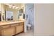 Clean bathroom with wood vanity and a combined shower and bath at 3751 W 136Th Ave # P3, Broomfield, CO 80023