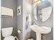 Stylish powder room featuring modern fixtures, pedestal sink, and elegant decor at 3751 W 136Th Ave # P3, Broomfield, CO 80023