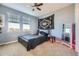 Comfortable bedroom with three windows and soft carpet flooring at 3751 W 136Th Ave # P3, Broomfield, CO 80023
