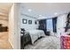 Cozy carpeted bedroom with a queen size bed, dresser, and TV at 3751 W 136Th Ave # P3, Broomfield, CO 80023