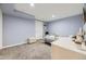 Bedroom with light blue walls, carpet, and a white wooden desk and chair at 3751 W 136Th Ave # P3, Broomfield, CO 80023