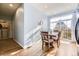 Sun-filled dining area featuring hardwood floors, slider to patio, and stylish decor at 3751 W 136Th Ave # P3, Broomfield, CO 80023