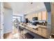 Open-concept kitchen with granite countertops, a breakfast bar, and ample cabinet space at 3751 W 136Th Ave # P3, Broomfield, CO 80023