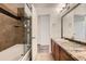 Beautiful bathroom featuring shower/tub with glass door and granite countertops at 9300 E Florida Ave # 1101, Denver, CO 80247