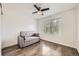 Cozy bedroom showcasing a sofa, sleek ceiling fan, and natural light at 9300 E Florida Ave # 1101, Denver, CO 80247