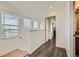 Bright hallway featuring wood floors and two windows with natural light at 9300 E Florida Ave # 1101, Denver, CO 80247