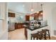 Modern kitchen featuring stainless steel appliances and dark wood cabinets at 9300 E Florida Ave # 1101, Denver, CO 80247