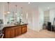 Kitchen island with granite countertop, wood cabinets, and pendant lighting at 9300 E Florida Ave # 1101, Denver, CO 80247