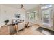 Inviting living room featuring a ceiling fan, large window, and stylish decor at 9300 E Florida Ave # 1101, Denver, CO 80247