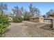 Backyard with a shed and surrounding foliage at 7950 Maria St, Westminster, CO 80030