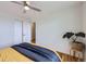 Bedroom featuring hardwood floors, a large closet, and a leafy green houseplant at 7950 Maria St, Westminster, CO 80030