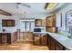 An expansive kitchen with wood cabinets and ample natural light through a large window at 7950 Maria St, Westminster, CO 80030