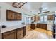 Classic kitchen with wood cabinets, a window, and modern appliances at 7950 Maria St, Westminster, CO 80030