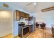 This kitchen includes stainless steel appliances, a breakfast nook, and wood cabinets at 7950 Maria St, Westminster, CO 80030