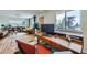 Office area with hardwood floors, built-in desk, and a nice view of the living room at 7950 Maria St, Westminster, CO 80030