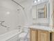 Bright bathroom features tiled shower, vanity with storage, and modern fixtures at 2675 S Carson Way, Aurora, CO 80014