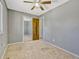 Bedroom with neutral walls and carpeted floors, featuring closet and window for natural light at 2675 S Carson Way, Aurora, CO 80014