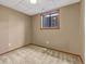 Bedroom featuring neutral walls and carpet with a window offering natural light at 2675 S Carson Way, Aurora, CO 80014