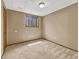 Bedroom featuring a window, neutral carpet, and blank walls at 2675 S Carson Way, Aurora, CO 80014