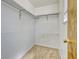 Walk-in closet with carpet, shelving and hanging rods for storage and organization at 2675 S Carson Way, Aurora, CO 80014