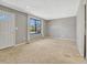 Inviting living room features large window, neutral decor, and an abundance of natural light at 2675 S Carson Way, Aurora, CO 80014