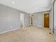 Spacious living room with carpeted floors, recessed lighting, and convenient access to other areas at 2675 S Carson Way, Aurora, CO 80014