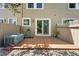 Fenced backyard with a wooden deck, decorative rock, and a sliding glass door at 3300 W Florida Ave # 117, Denver, CO 80219
