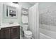 Light and airy bathroom featuring tiled shower with decorative accents at 3300 W Florida Ave # 117, Denver, CO 80219