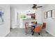 Cozy dining area featuring modern light fixture, seating for four, and backyard access at 3300 W Florida Ave # 117, Denver, CO 80219