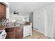 Updated kitchen with a double sink, light cabinets, and a modern tile backsplash at 3300 W Florida Ave # 117, Denver, CO 80219