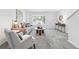 Inviting living room with a bay window, modern decor, and plush carpeting at 3300 W Florida Ave # 117, Denver, CO 80219