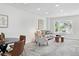 Spacious living area featuring a large window with natural light and neutral tones at 3300 W Florida Ave # 117, Denver, CO 80219