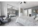 Bright main bedroom with mirrored closet and access to ensuite bathroom at 3300 W Florida Ave # 117, Denver, CO 80219
