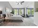 Spacious main bedroom with ample natural light and a mirrored closet at 3300 W Florida Ave # 117, Denver, CO 80219