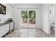 Sliding glass doors opening to a private patio and a fully fenced backyard at 3300 W Florida Ave # 117, Denver, CO 80219