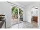 Sunny patio area with sliding glass doors and access to a well-maintained bathroom at 3300 W Florida Ave # 117, Denver, CO 80219