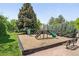 Community playground with a slide and play structure at 3300 W Florida Ave # 117, Denver, CO 80219