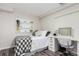 Basement bedroom with a built-in shelving unit and desk at 8172 S York Ct, Centennial, CO 80122