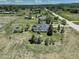 Aerial view of property with expansive grounds and established landscaping at 1428 S County Road 23E, Berthoud, CO 80513